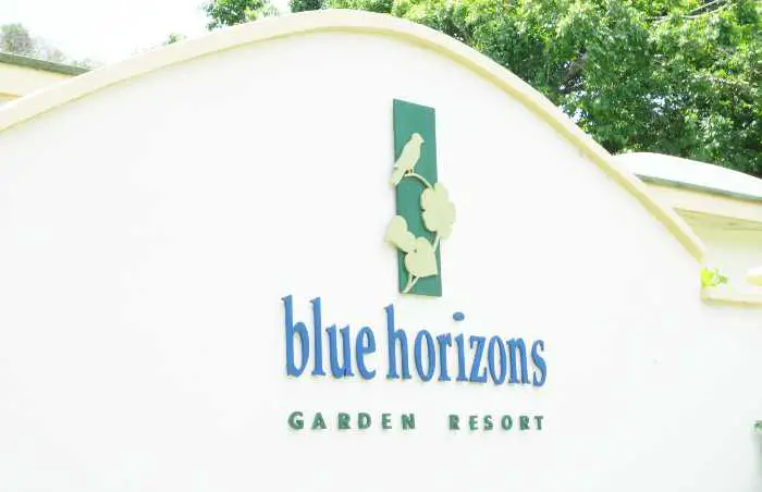 The entrance sign to Blue Horizon Garden Resort