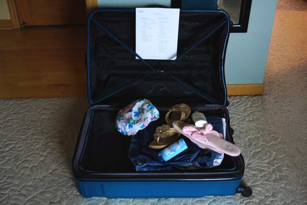 large suitcase opened with items in it