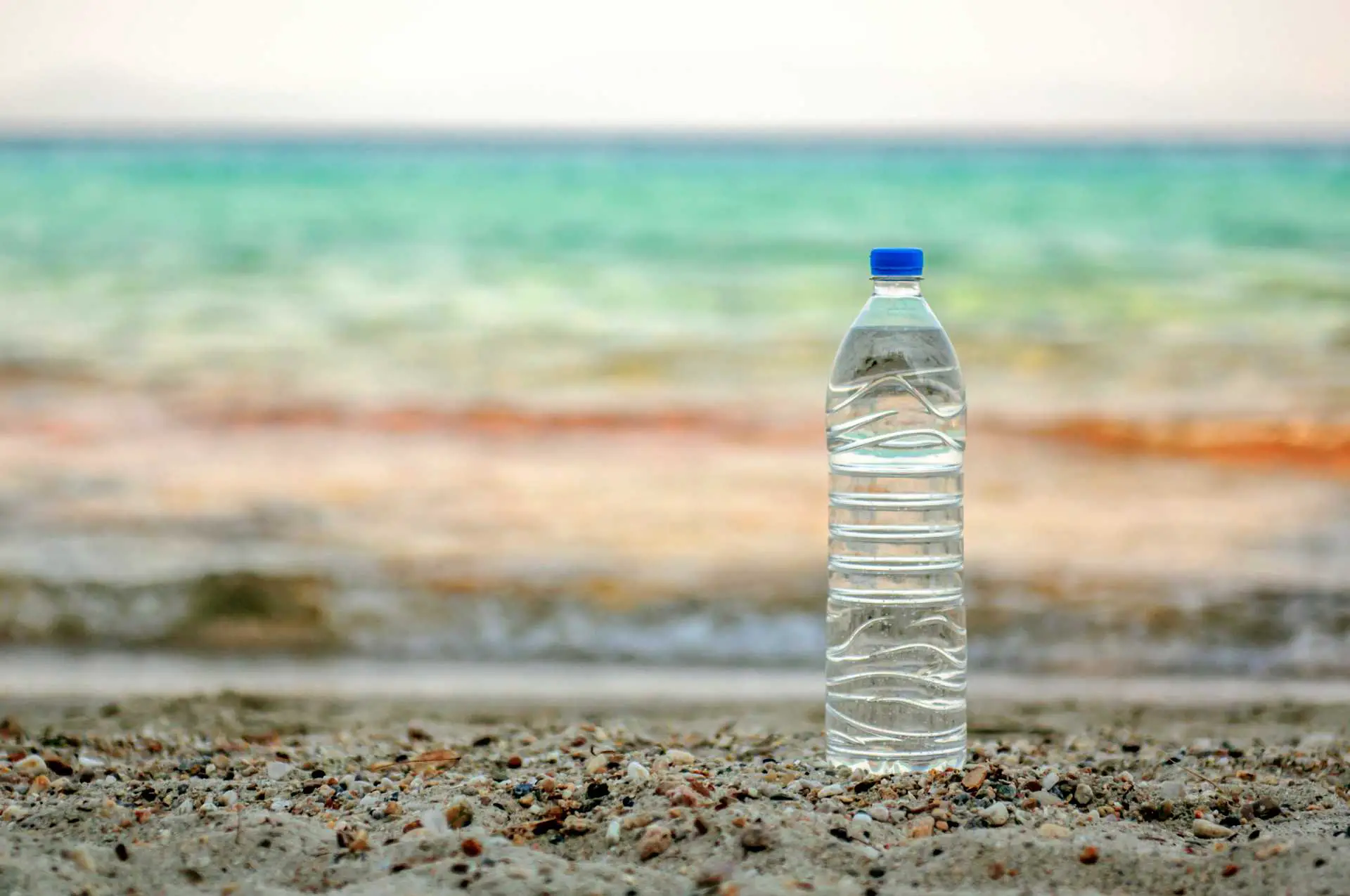 water bottle on the beach