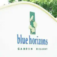 The entrance sign to Blue Horizon Garden Resort